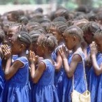 girls praying at schoolimagesCALG2C1K
